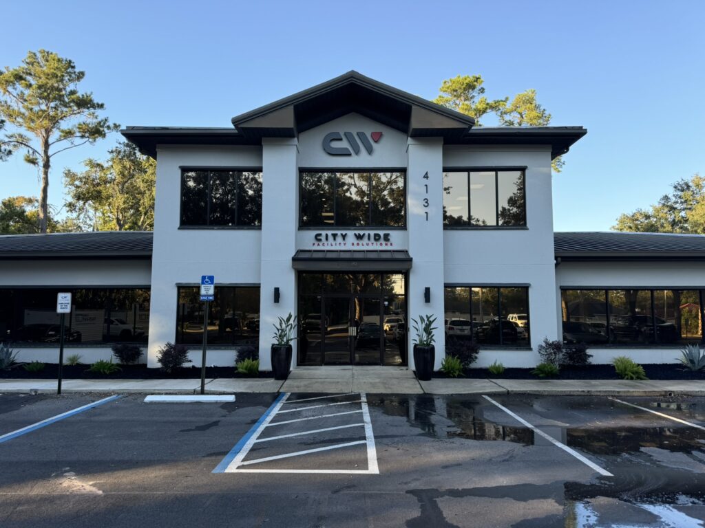 Commercial building landscape design with entrance plantings and modern architecture